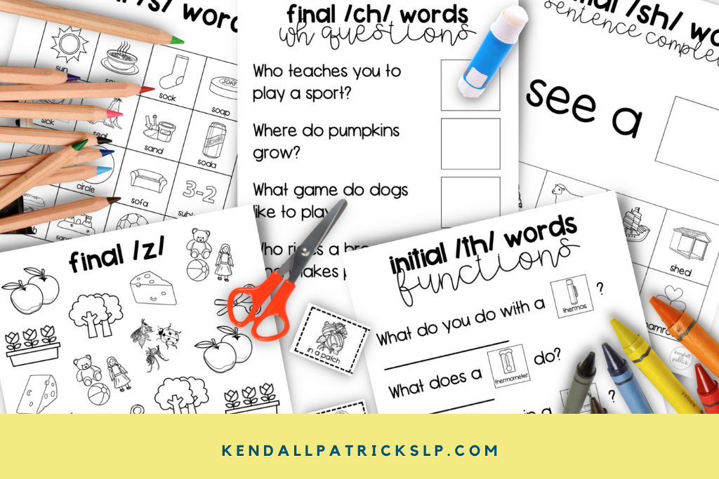 articulation worksheets and activities spread on a table with craft supplies
